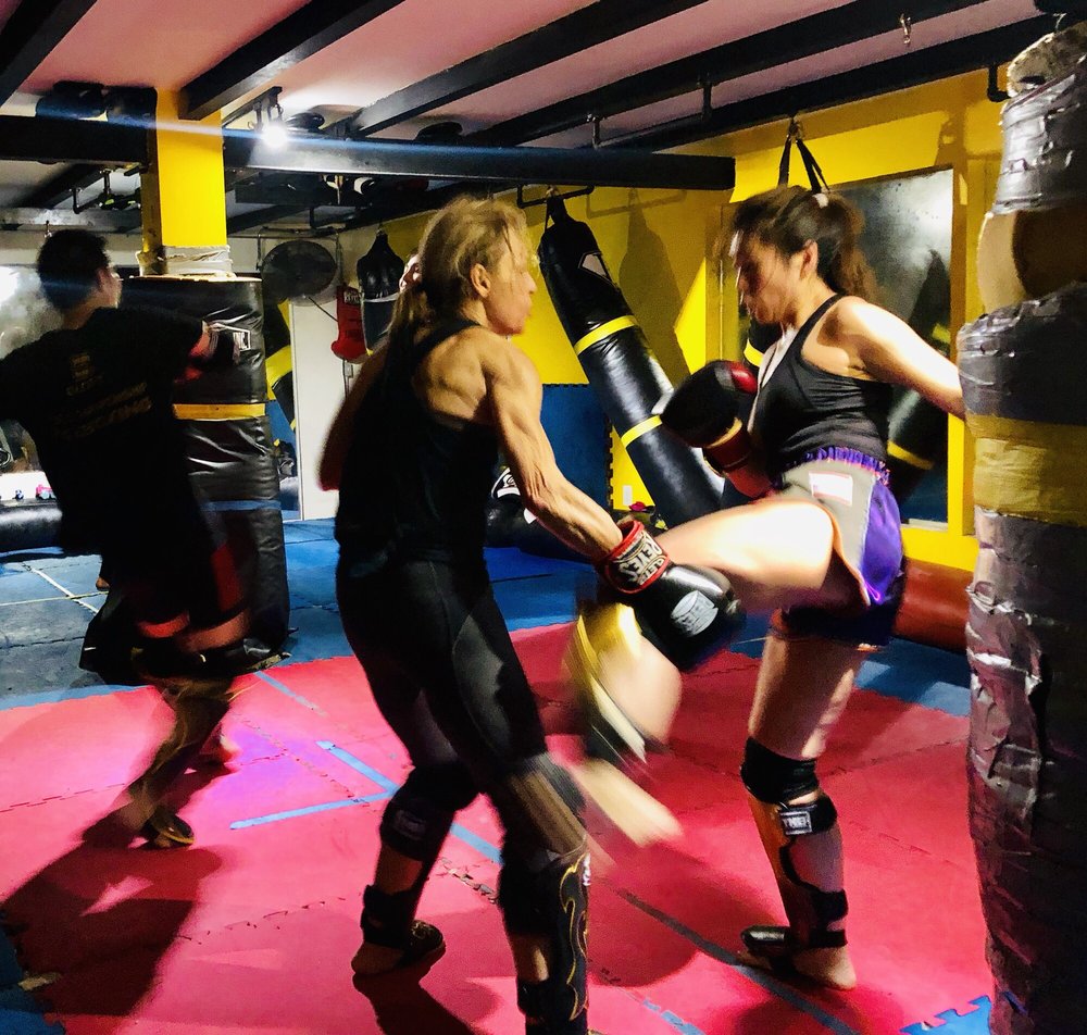 Members training Muay Thai kicks together at Strikers Inc. in San Gabriel