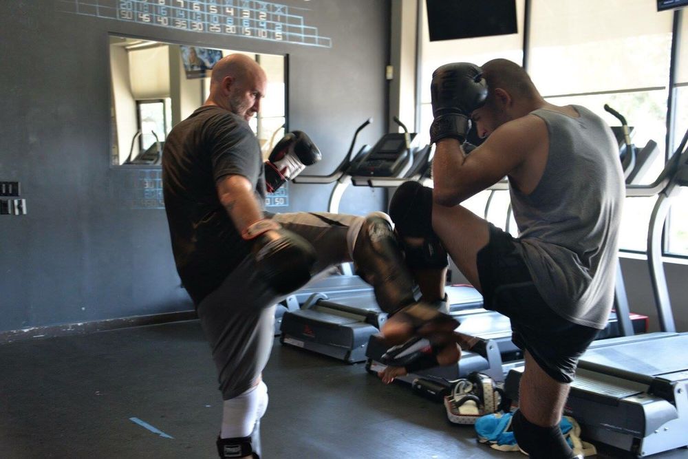 Strikers Inc. members training kickboxing technique together in San Gabriel